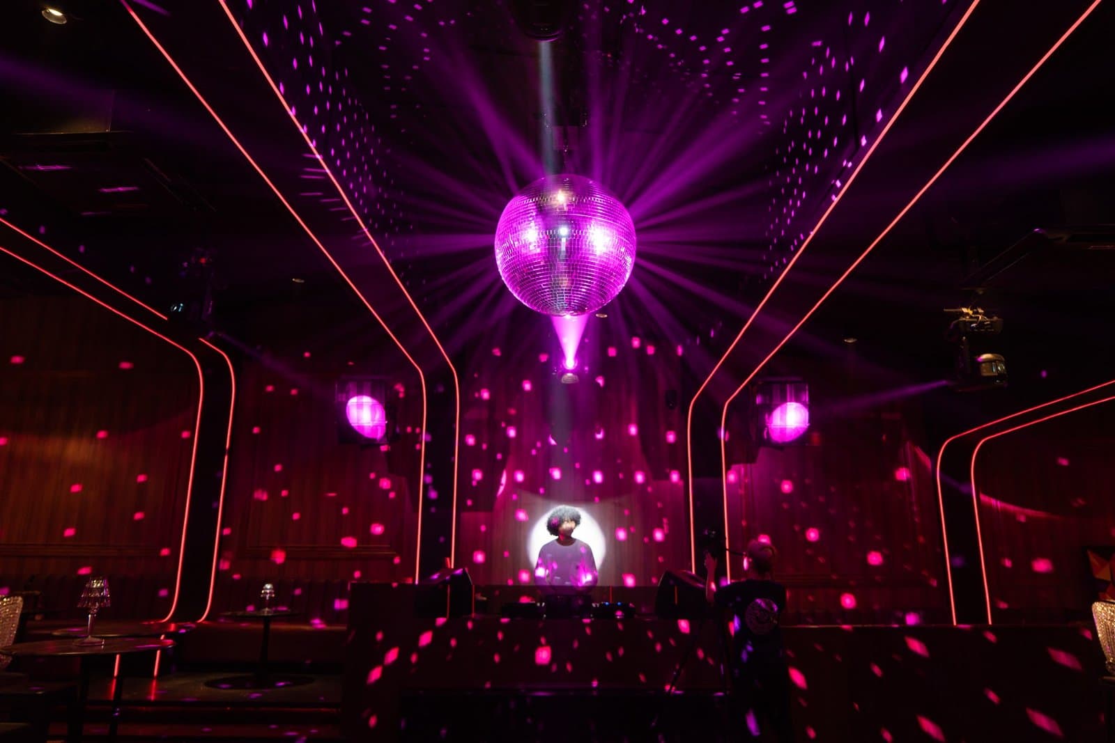 Corner booth with a disco ball.